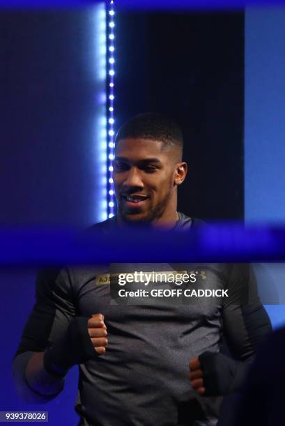 Britain's Anthony Joshua attends a pre-fight public work out press conference at St David's Hall in Cardiff, south Wales on March 28, 2018 ahead of...