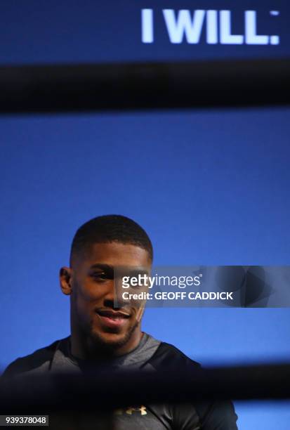 Britain's Anthony Joshua attends a pre-fight public work out press conference at St David's Hall in Cardiff, south Wales on March 28, 2018 ahead of...