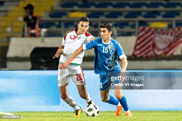 Mohamed Nahiri of Morocco, Sardor Mirzayev of Uzbekistan during the international friendly match between Morocco and Uzbekistan at the Stade Mohammed...
