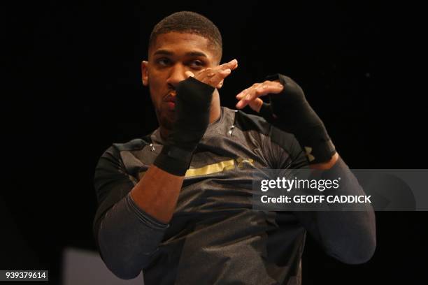 Britain's Anthony Joshua attends a pre-fight public work out press conference at St David's Hall in Cardiff, south Wales on March 28, 2018 ahead of...