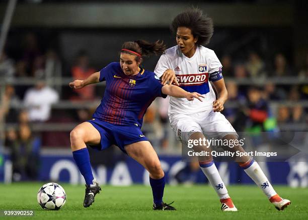 Mariona Caldentey of Barcelona competes for the ball with Wendie Renard of Olympique Lyon during the UEFA Women's Champions League Quarter Final 2nd...