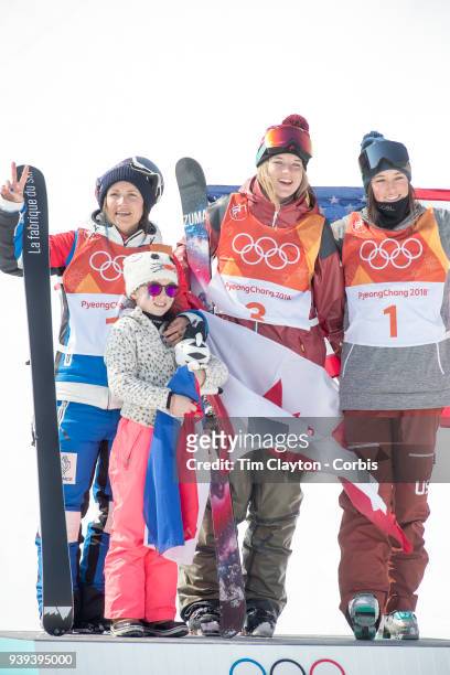 Marie Martinod of France after winning the silver medal celebrates with daughter Meli Rose along with gold medalist Cassie Sharpe of Canada and...