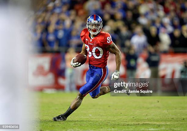 Dezmon Briscoe of the Kansas Jayhawks runs with the ball for yardage during their game against the Missouri Tigers during the game at Arrowhead...