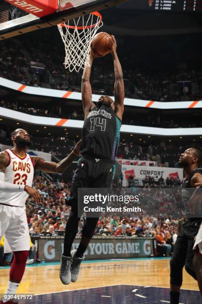 Michael Kidd-Gilchrist of the Charlotte Hornets handles the ball against the Cleveland Cavaliers on March 28, 2018 at Spectrum Center in Charlotte,...