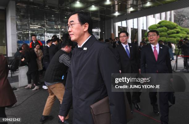 South Korean Unification Minister Cho Myoung-gyon walks to leave for the border truce village of Panmunjom, at a government building in Seoul on...