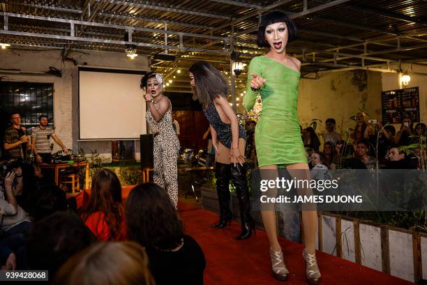 In this photograph taken on March 24 Vietnamese drag queens Betty performs with Vanessa and Pinky perform at a local bar in Hanoi. A vanguard of...
