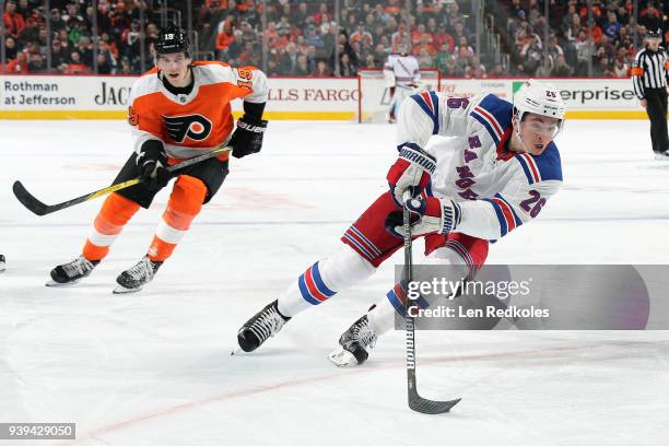 Jimmy Vesey of the New York Rangers skates against Nolan Patrick of the Philadelphia Flyers on March 22, 2018 at the Wells Fargo Center in...