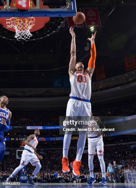 Enes Kanter of the New York Knicks grabs the rebound against the Philadelphia 76ers at Wells Fargo Center on March 28, 2018 in Philadelphia,...