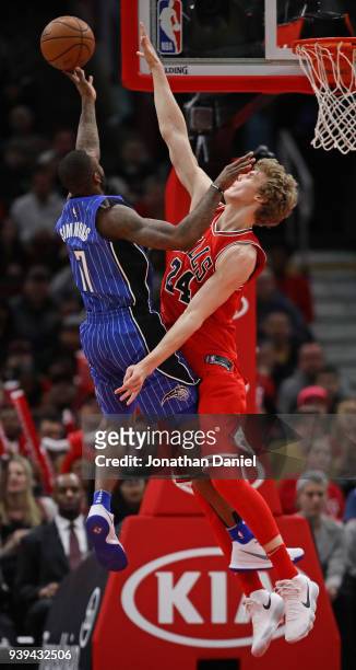 Jonathon Simmons of the Orlando Magic puts up a shot against Lauri Markkanen of the Chicago Bulls at the United Center on February 12, 2018 in...