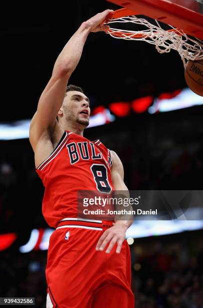 Zach LaVine of the Chicago Bulls dunks after stealing an inbounds pass near the end of the game against the Orlando Magic at the United Center on...