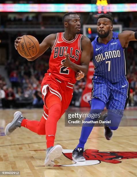 Jerian Grant of the Chicago Bulls drives against Shelvin Mack of the Orlando Magic at the United Center on February 12, 2018 in Chicago, Illinois....