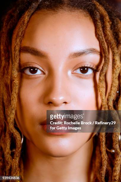 Beauty Portrait of Young Confident Woman with Dreadlocks