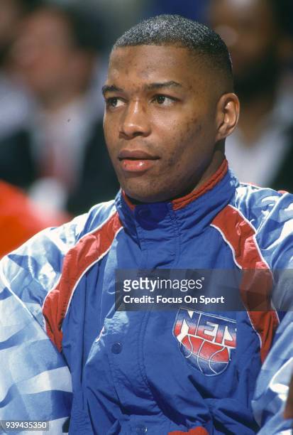 Derrick Coleman of the New Jersey Nets looks on from the bench against the Washington Bullets during an NBA basketball game circa 1991 at The Capital...