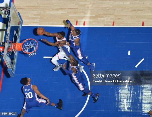Emmanuel Mudiay of the New York Knicks goes up for the layup against the Philadelphia 76ers at Wells Fargo Center on March 28, 2018 in Philadelphia,...