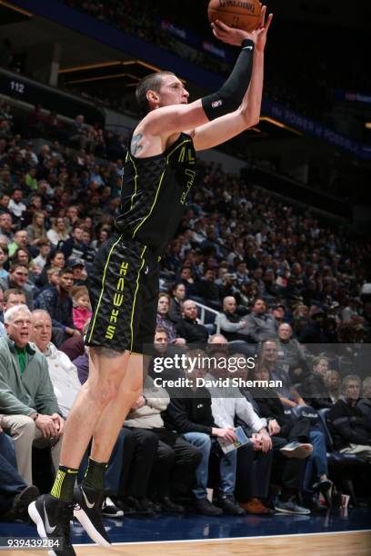 Mike Muscala of the Atlanta Hawks shoots the ball against the Minnesota Timberwolves on March 28, 2018 at Target Center in Minneapolis, Minnesota....