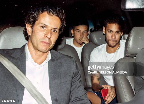 In this file photo taken on March 02, 2018 Brazilian superstar Neymar , is pictured next to his doctor Rodrigo Lasmar , upon his arrival in Belo...