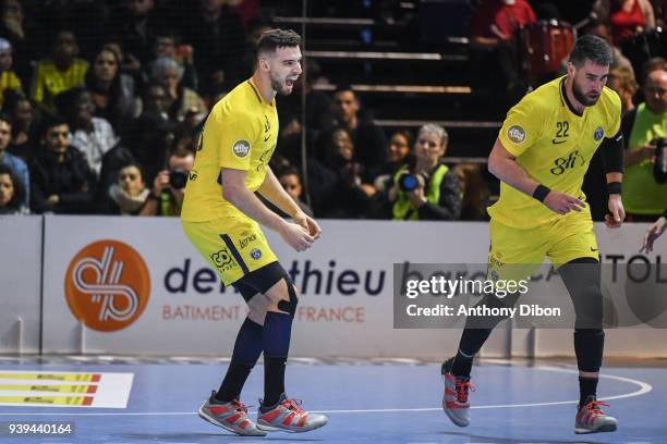 Nedim Remili and Luka Karabatic celebrate during the Lidl Star Ligue match between Ivry and Paris Saint Germain on March 28, 2018 in Paris, France.