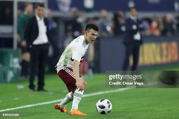 Hirving Lozano of Mexico drives the ball during the international friendly match between Mexico and Croatia at AT&T Stadium on March 27, 2018 in...