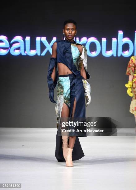 Model walks the runway wearing Eaux Troubles at 2018 Vancouver Fashion Week - Day 7 on March 25, 2018 in Vancouver, Canada.