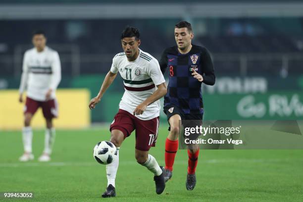 Carlos Vela of Mexico fights for the ball with Mateo Kovacic of Croatia during the international friendly match between Mexico and Croatia at AT&T...