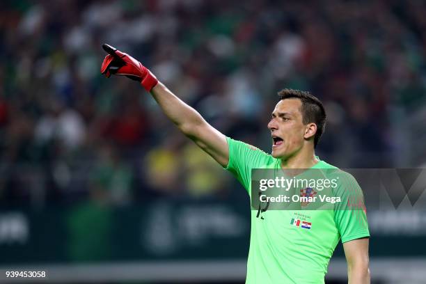 Goalkeeper Lovre Kalinic of Croatia gestures during the international friendly match between Mexico and Croatia at AT&T Stadium on March 27, 2018 in...