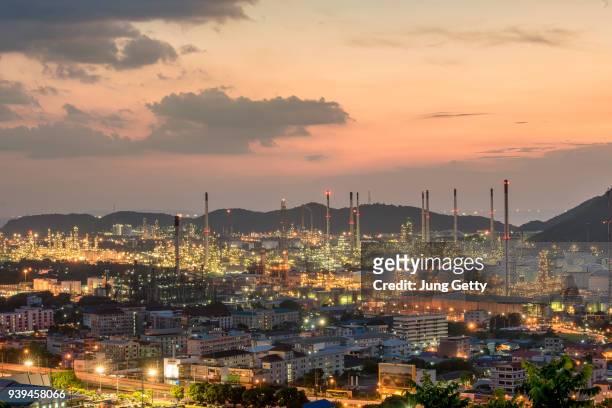 aerial view oil refinery.industrial view at oil refinery plant form industry zone with sunset and cloudy sky. - refine stock pictures, royalty-free photos & images