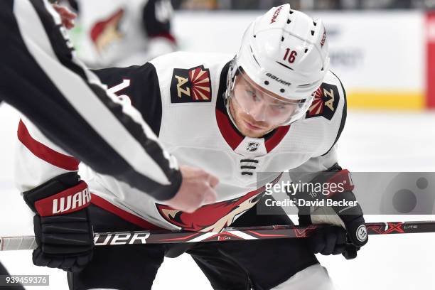 Max Domi of the Arizona Coyotes takes a faceoff against the Vegas Golden Knights during the game at T-Mobile Arena on March 28, 2018 in Las Vegas,...