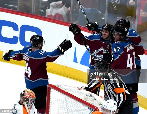 Colorado Avalanche left wing Matt Nieto celebrates his goal with center Dominic Toninato defenseman Erik Johnson and left wing Blake Comeau during...