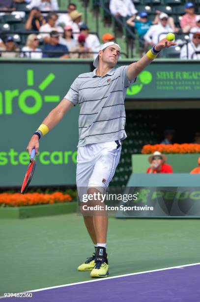 John Isner in action during day 10 of the 2018 Miami Open held at the Crandon Park Tennis Center on March 28 in in Key Biscayne, Florida.