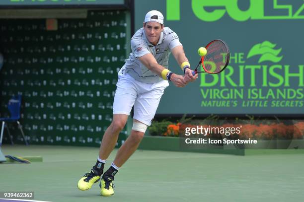 John Isner in action during day 10 of the 2018 Miami Open held at the Crandon Park Tennis Center on March 28 in in Key Biscayne, Florida.