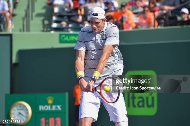 John Isner in action during day 10 of the 2018 Miami Open held at the Crandon Park Tennis Center on March 28 in in Key Biscayne, Florida.