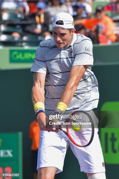 John Isner in action during day 10 of the 2018 Miami Open held at the Crandon Park Tennis Center on March 28 in in Key Biscayne, Florida.