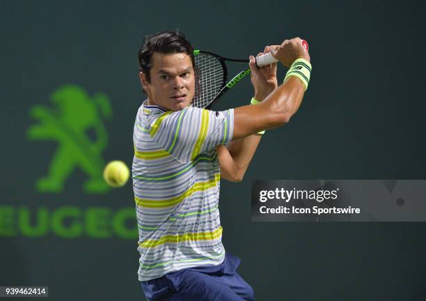 Milos Raonic in action during day 10 of the 2018 Miami Open held at the Crandon Park Tennis Center on March 28 in in Key Biscayne, Florida.