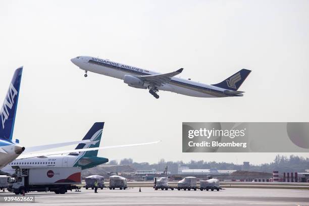 An Airbus SE A330-343 aircraft, operated by Singapore Airlines Ltd. , takes off at Changi Airport in Singapore, on Wednesday, March 28, 2018....