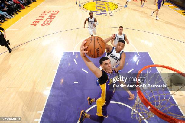 Lonzo Ball of the Los Angeles Lakers dunks the ball during the game against the Dallas Mavericks on March 28, 2018 at STAPLES Center in Los Angeles,...