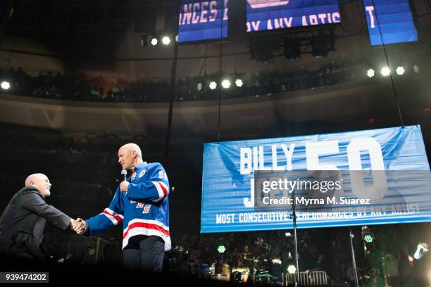 Musican Billy Joel and former New York Rangers player Mark Messier come together to celebrate the 50th consecutive show of Joel's residency at...