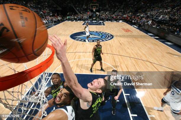 Mike Muscala of the Atlanta Hawks dunks against the Minnesota Timberwolves on March 28, 2018 at Target Center in Minneapolis, Minnesota. NOTE TO...