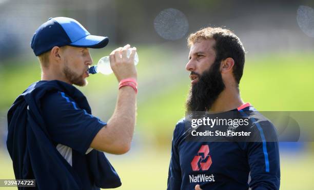 England spinner Moeen Ali chats with captain Joe Root during England nets ahead of the second test match against the New Zealand Black Caps at Hagley...