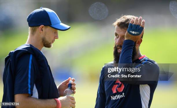 England spinner Moeen Ali chats with captain Joe Root during England nets ahead of the second test match against the New Zealand Black Caps at Hagley...