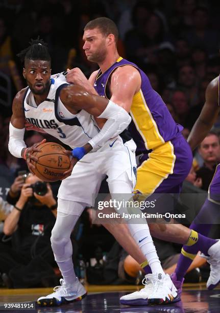 Brook Lopez of the Los Angeles Lakers defends Nerlens Noel of the Dallas Mavericks as he looks to pass the ball in the second half of the game at...