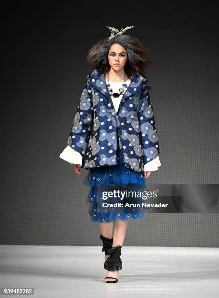 Model walks the runway wearing Krizia Jimenez at 2018 Vancouver Fashion Week - Day 7 on March 25, 2018 in Vancouver, Canada.