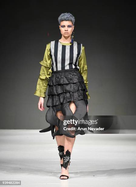 Model walks the runway wearing Krizia Jimenez at 2018 Vancouver Fashion Week - Day 7 on March 25, 2018 in Vancouver, Canada.