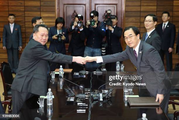 South Korean Unification Minister Cho Myoung Gyon and Ri Son Gwon, chairman of North Korea's Committee for the Peaceful Reunification of the Country,...