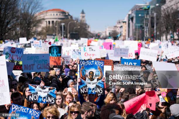 Crowds filled blocks of Pennsylvania Ave holding signs during march for our lives. Tens of thousands of Americans took to the street on Washington DC...