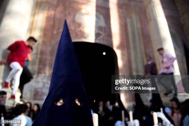 Penitent from "Nuestro Padre Jesús de las Tres Caidas" brotherhood seen in Holy Wednesday procession in Granada. Every year thousands of christians...