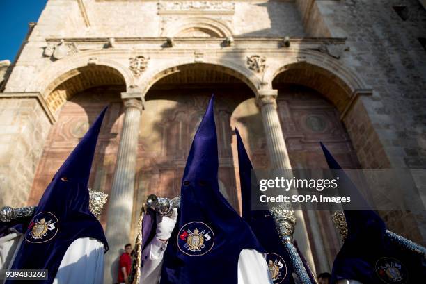 Penitents from "Nuestro Padre Jesus de las Tres Caidas" taking part in Holy Wednesday procession in Granada. Every year thousands of christians...