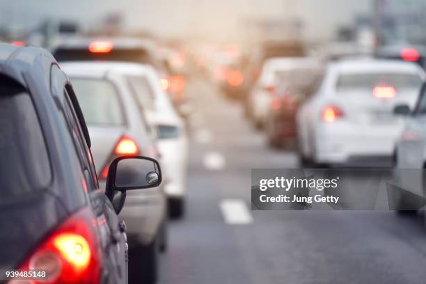 traffic jam at road.background blurred - contaminación ambiental fotografías e imágenes de stock