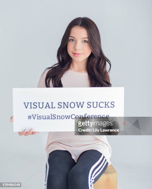 Kaylee Quinn poses with Visual Snow Conference at The Artists Project Giveback Day on March 28, 2018 in Los Angeles, California.
