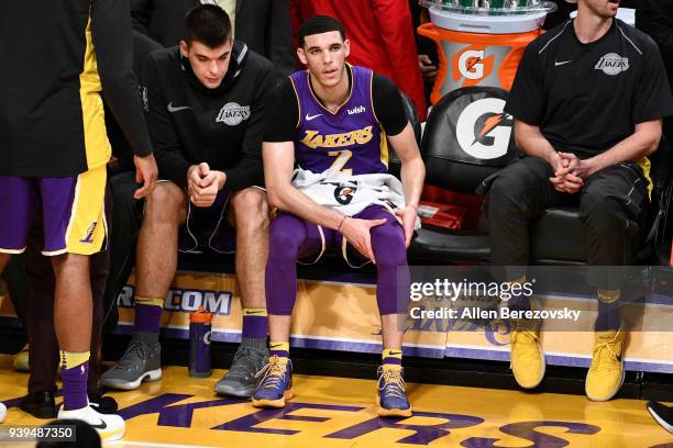 Lonzo Ball of the Los Angeles Lakers holds a sore knee during the second half of a basketball game against the Dallas Mavericks at Staples Center on...