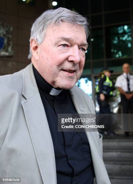 Cardinal George Pell leaves the court after his hearing at the Melbourne Magistrates Court in Melbourne on March 29, 2018. - The 76-year-old Pell,...